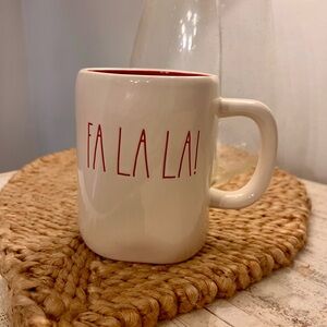 Rae Dunn "Fa La La!" ceramic coffee mug.